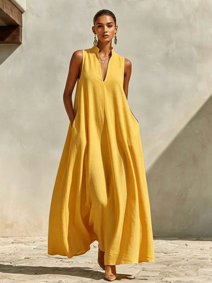 Robe longue ample sans manches en mélange de lin, avec col montant et poches