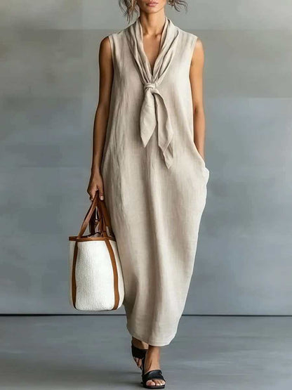 Robe trapèze mi-longue sans manches en lin beige naturel à nouer sur le devant