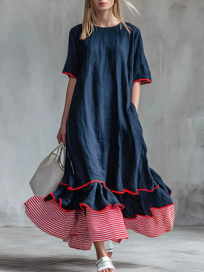 Robe longue ample en lin à rayures passepoilées et ourlet à volants