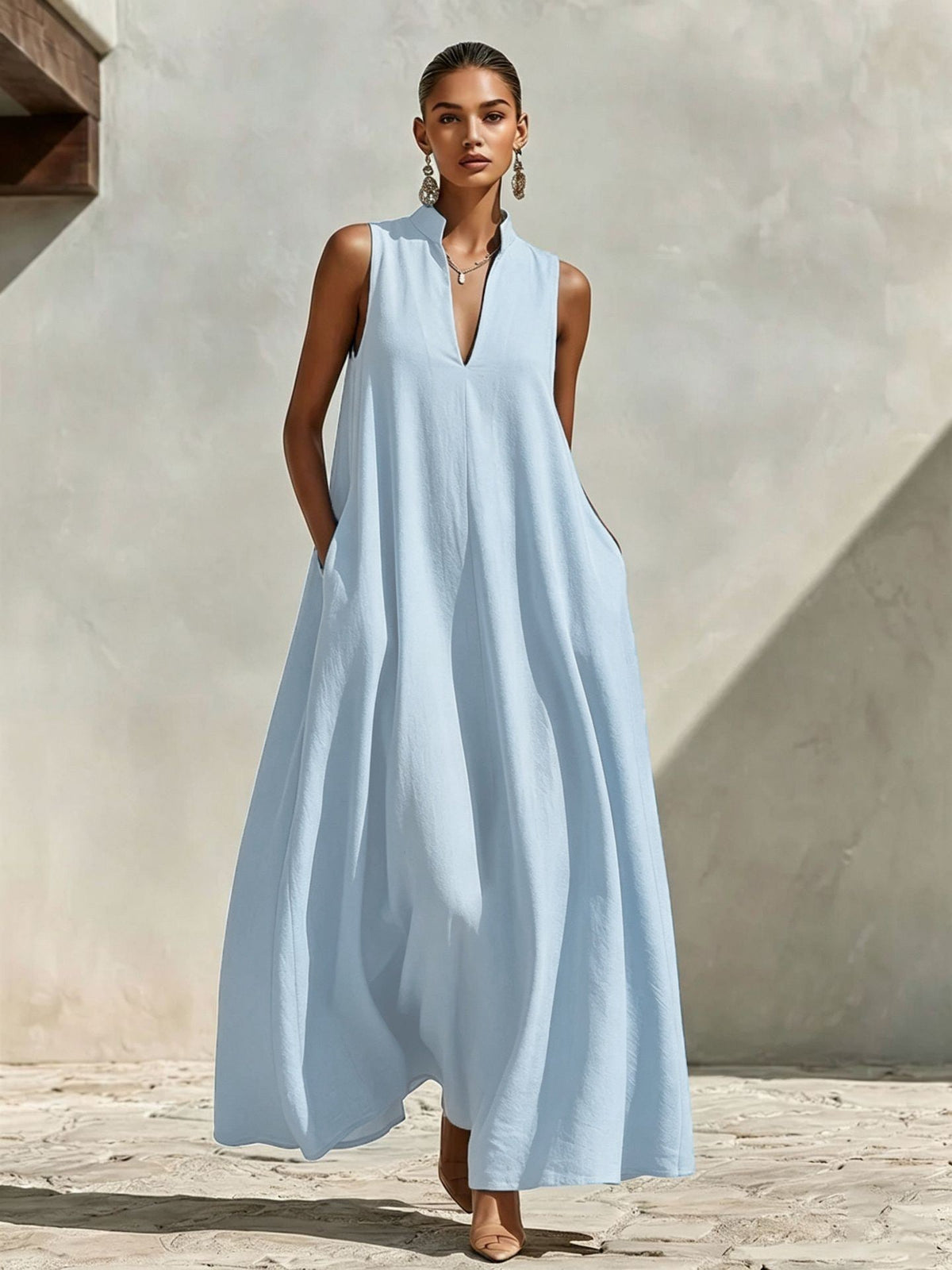 Robe longue ample sans manches en mélange de lin, avec col montant et poches