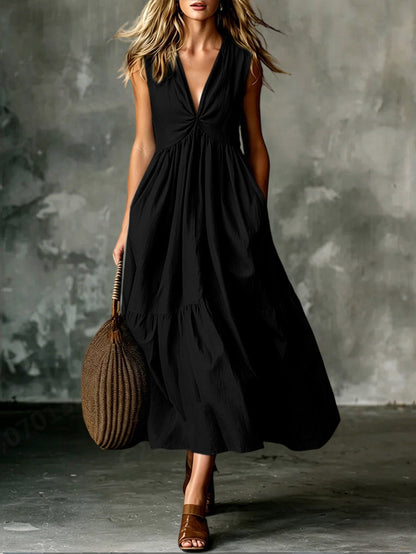 Robe longue texturée ample sans manches à col en V et devant torsadé avec poches