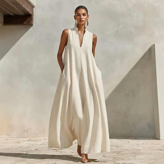Robe longue ample sans manches en mélange de lin, avec col montant et poches