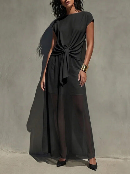 Robe longue élégante semi-transparente torsadée blanche