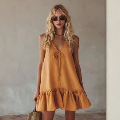 Mini-robe en lin à bretelles fines avec nœud sur le devant, couleur moutarde