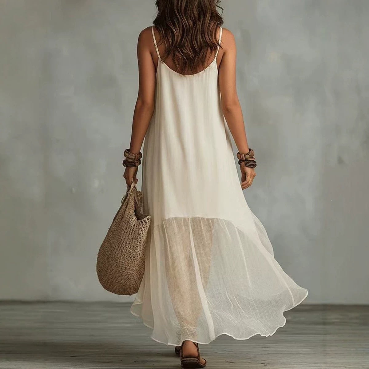 Robe longue sans manches en mousseline avec ourlet à volants irrégulier style bohème