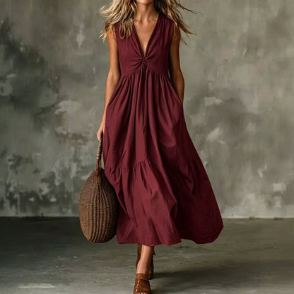 Robe longue texturée ample sans manches à col en V et devant torsadé avec poches