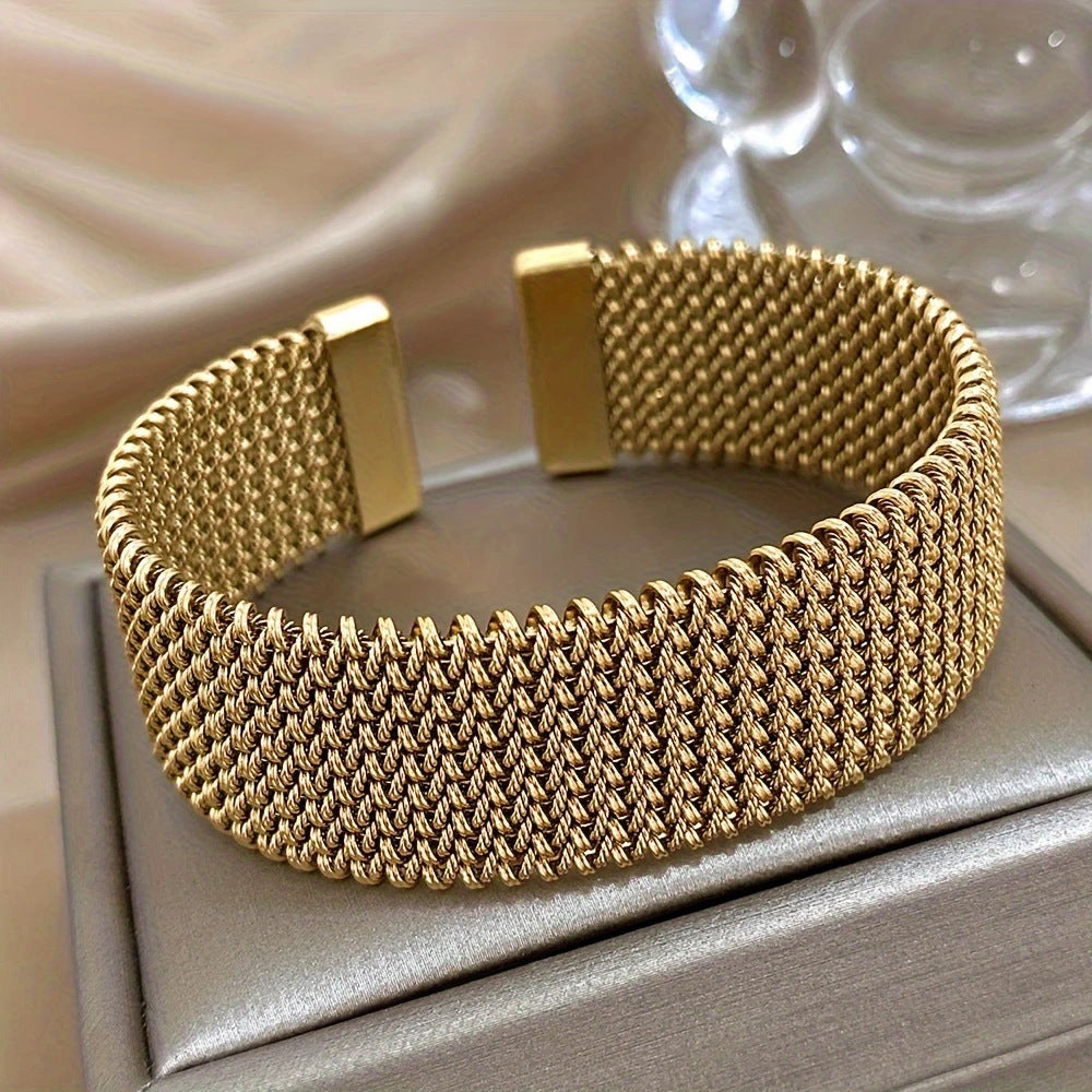 Golden cuff bracelet with mesh chain