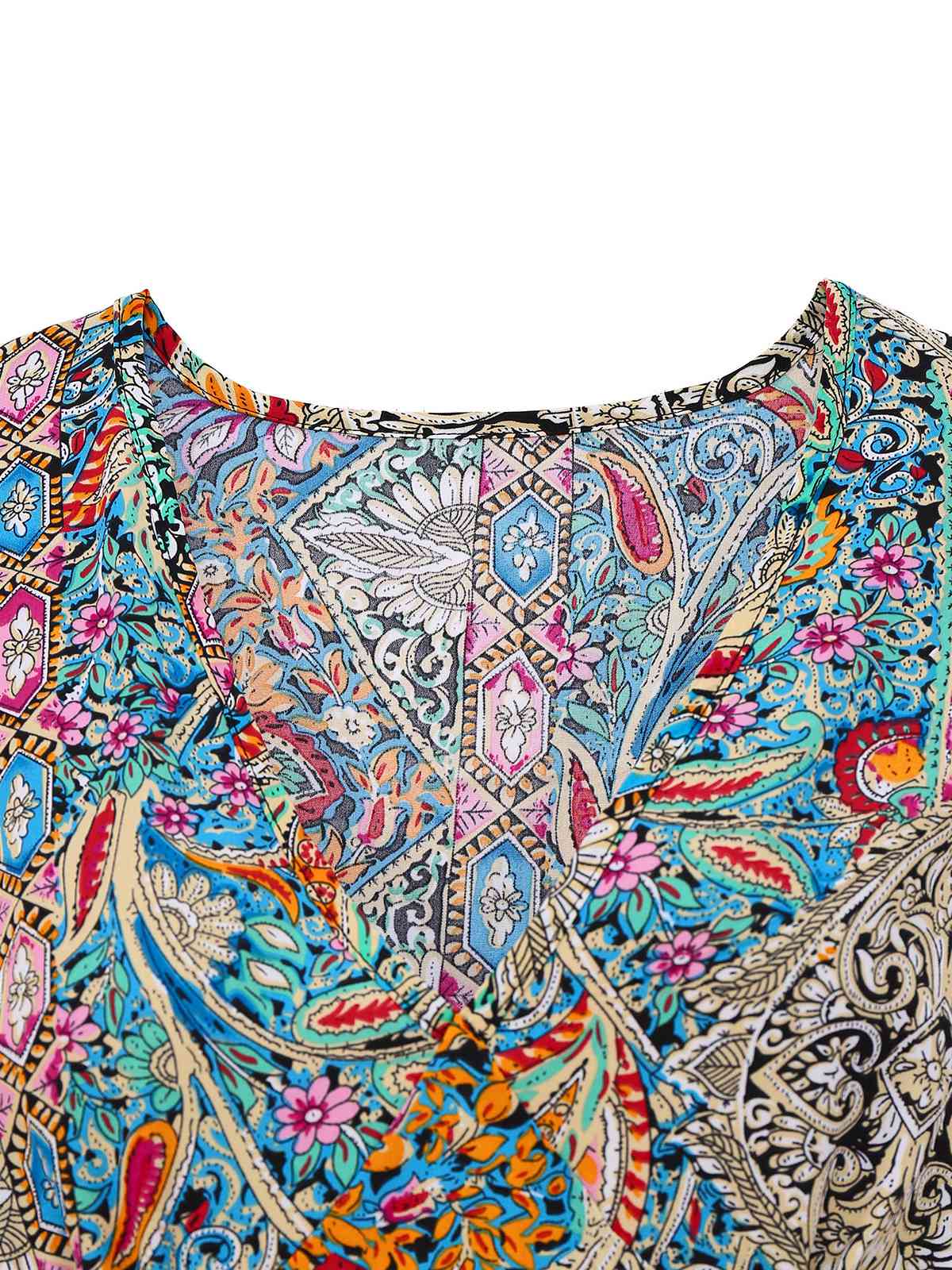 Bohemian dress with paisley and floral patterns, bell sleeves