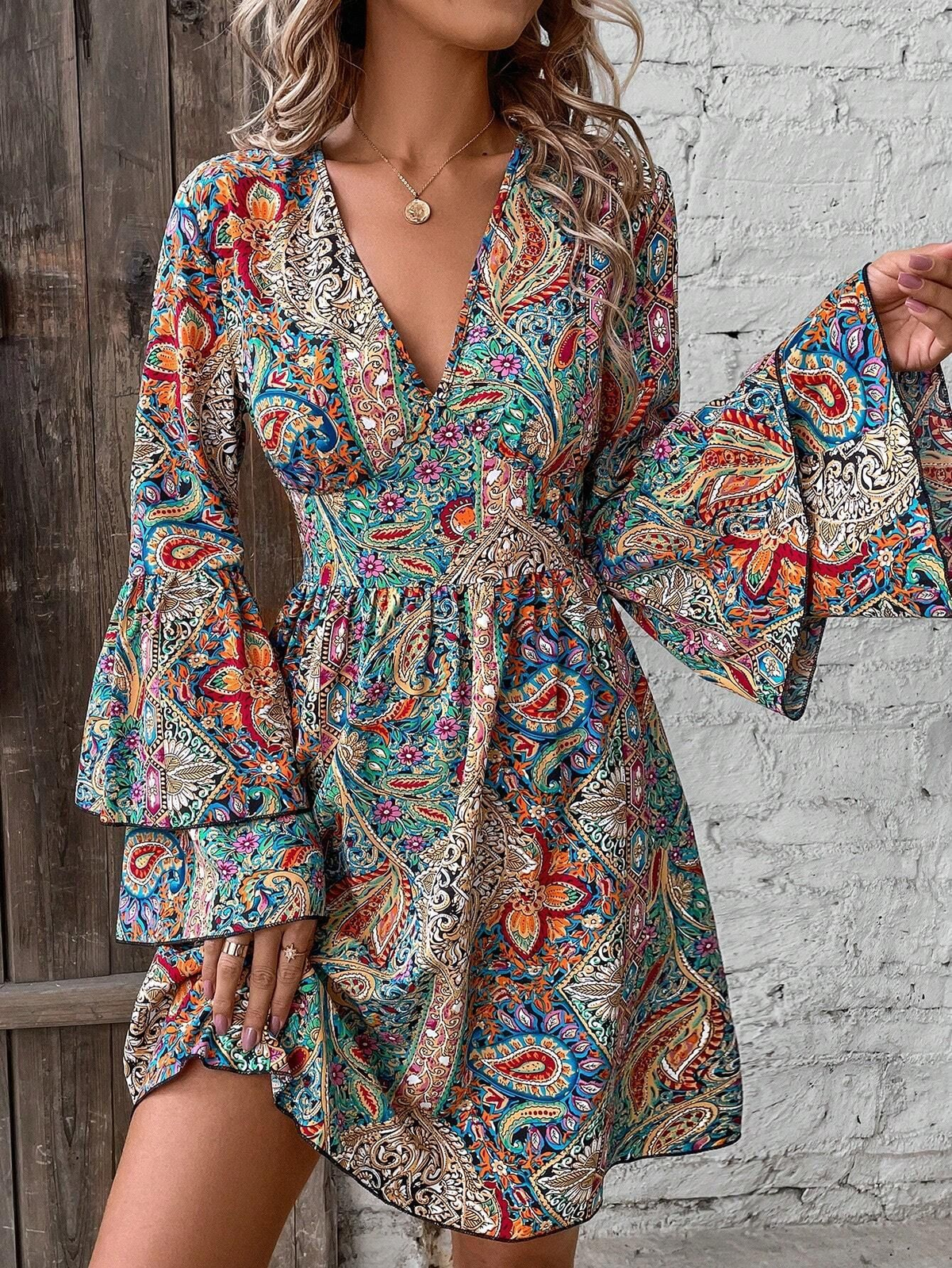 Bohemian dress with paisley and floral patterns, bell sleeves