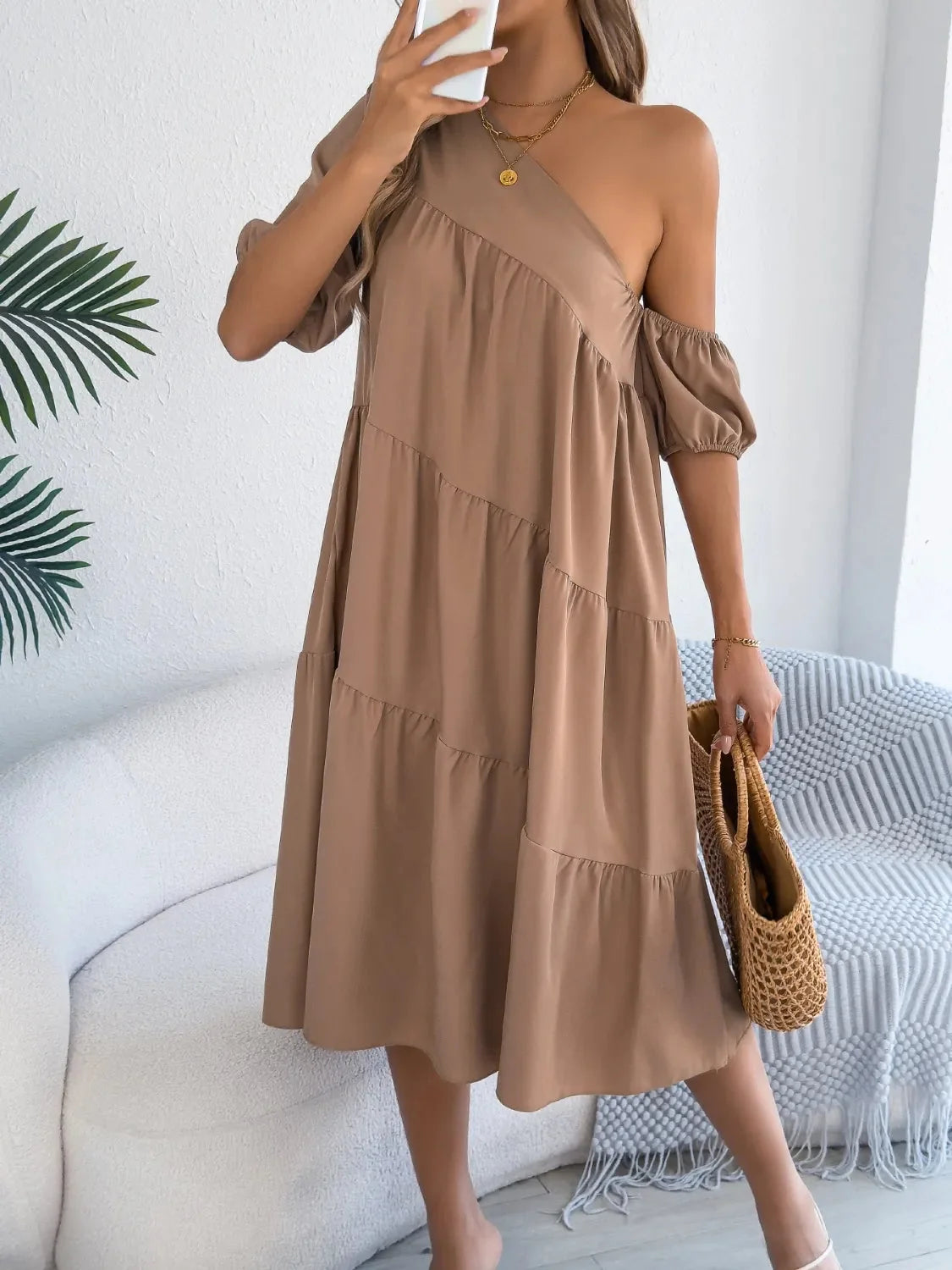One-shoulder dress with layered ruffles