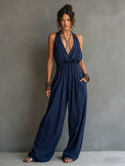 Combinaison pantalon dos nu décolleté en V, taille smockée et jambes larges palazzo