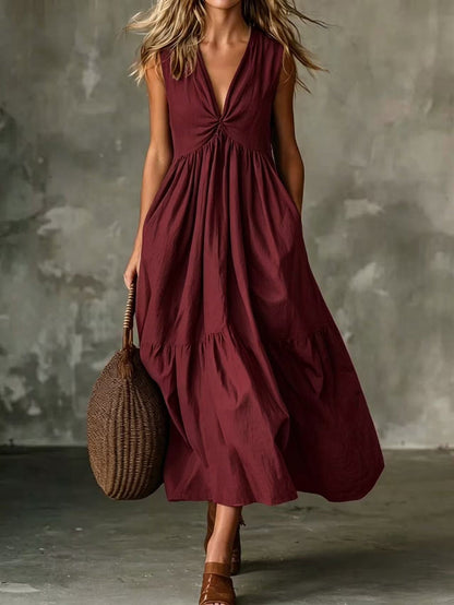 Robe longue texturée ample sans manches à col en V et devant torsadé avec poches