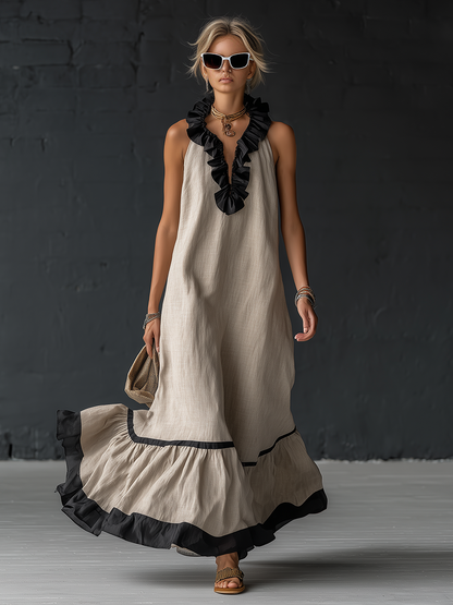 Élégante robe longue en coton et lin, sans manches, avec encolure en V, volants et blocs de couleurs.
