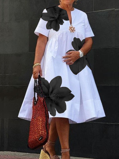 Robe midi plissée à imprimé et col en V