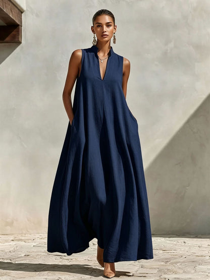 Robe longue ample sans manches en mélange de lin, avec col montant et poches
