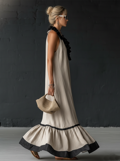 Élégante robe longue en coton et lin, sans manches, avec encolure en V, volants et blocs de couleurs.