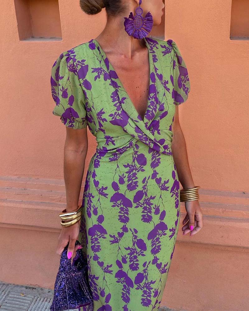 Elegant A-line dress with leaf print, deep V-neck, and puff sleeves