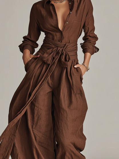 Elegant brown woven cotton-linen women's jumpsuit with long sleeves, shirt collar, and belt